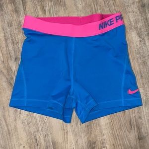Nike pro spandex shorts . Like new. Blue and pink. Size M